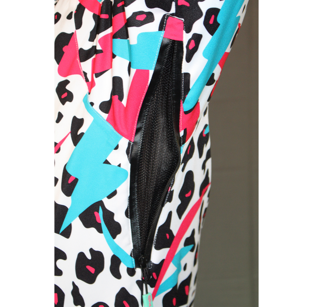 Close-up of an open black mesh pit vent on a white, teal, pink, and black Miami Ice Shred Suit