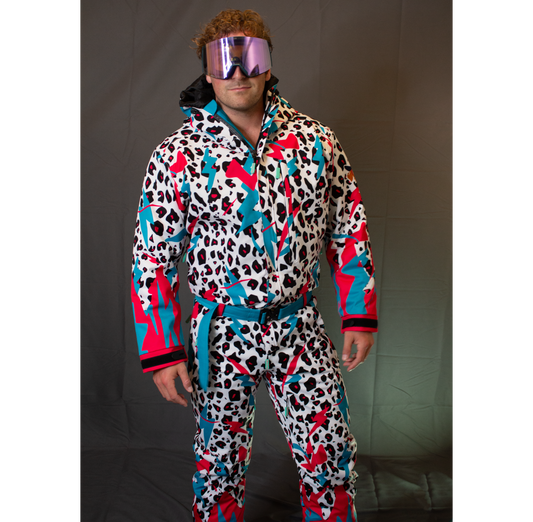 Model wearing the white Miami Ice Shred Suit with teal and red graphics, goggles, hood, belt, cuffs, and front pockets visible