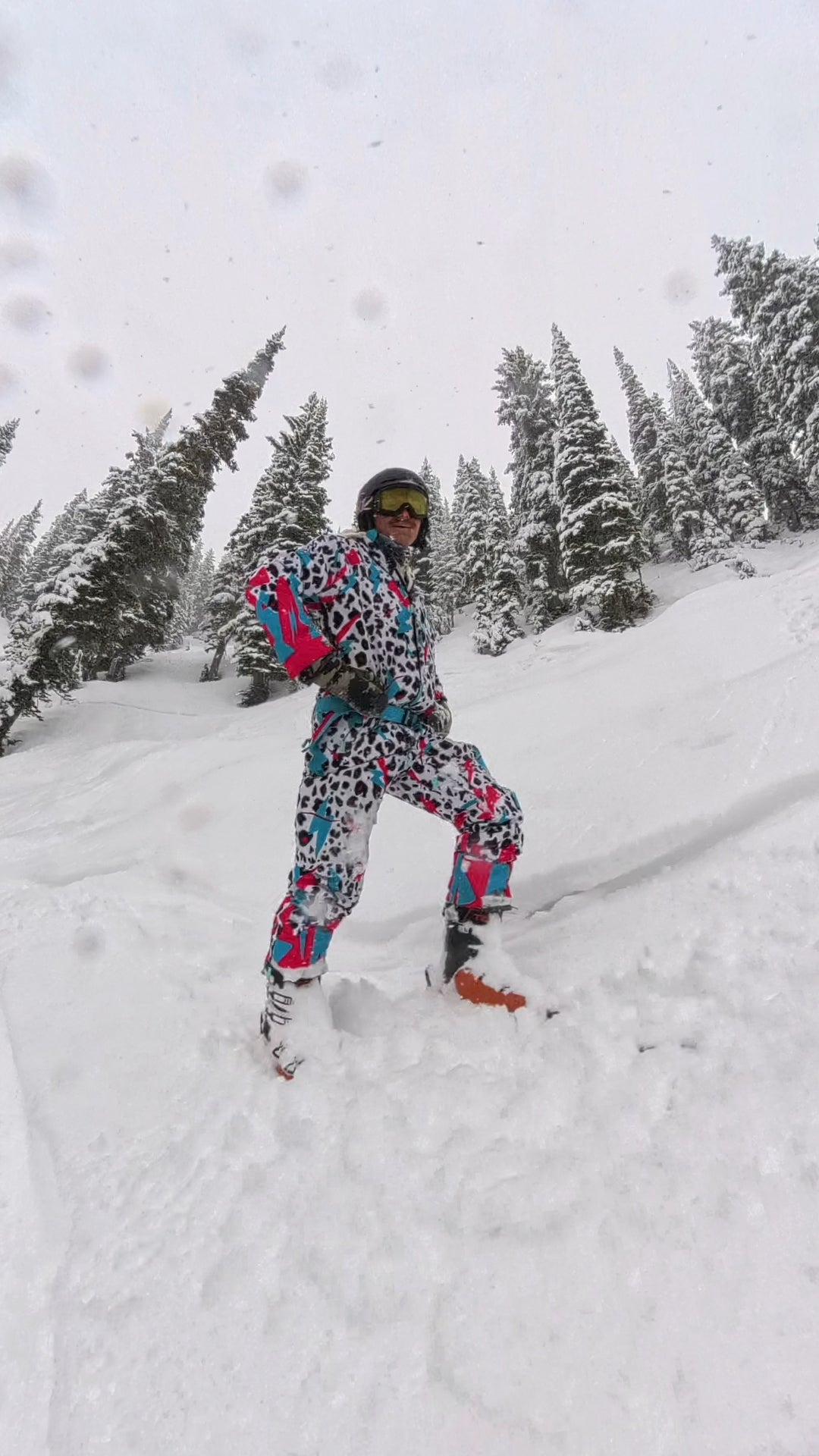 Person wearing the white, teal, pink, and black Miami Ice Shred Suit on snow